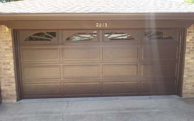 New brown ranch style garage door with colonial inserts