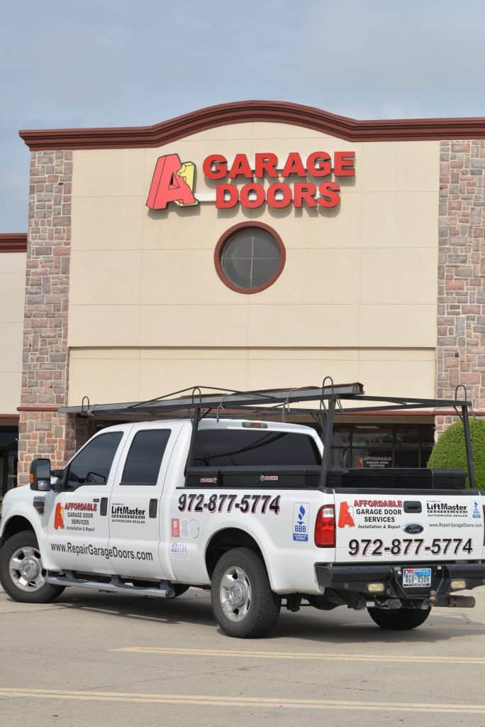 A1 Affordable Garage Door Services with Truck at the Plano Showroom